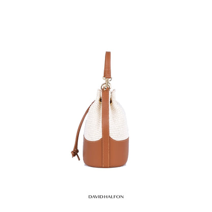 Calcutta C-Riva bucket bag in leather and handwoven ivory raffia, side view