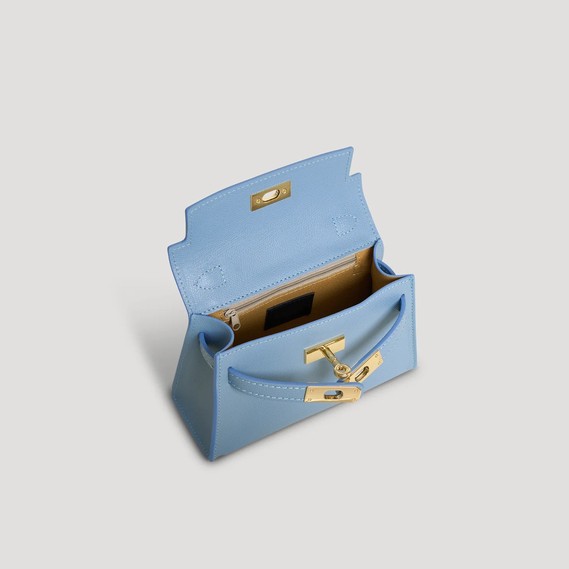 Diana S top-handle bag in hammered leather sky blue — interior view with microfiber lining and zipped pocket